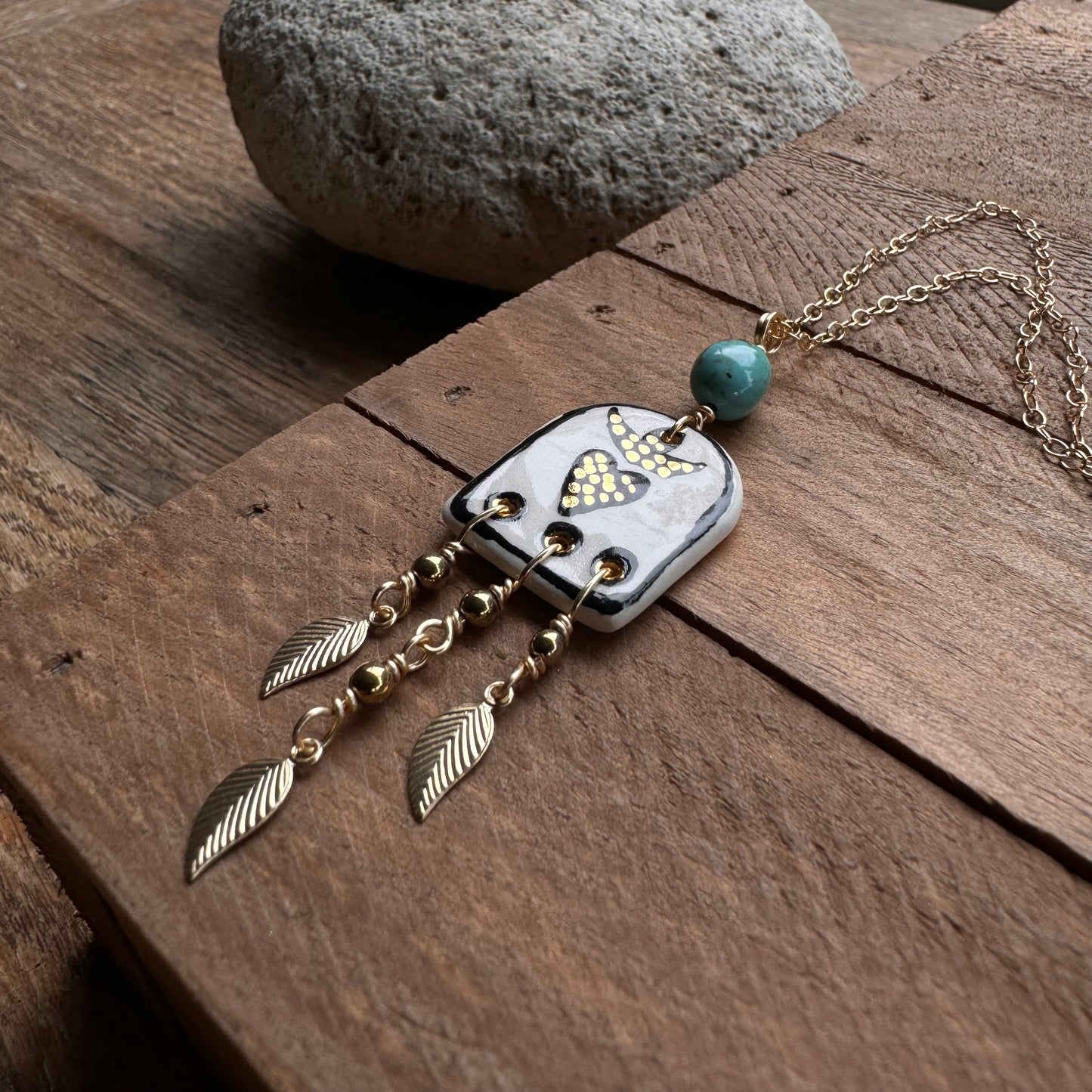 Ceramic black sacred heart and golden leaf fringe Charm Necklace