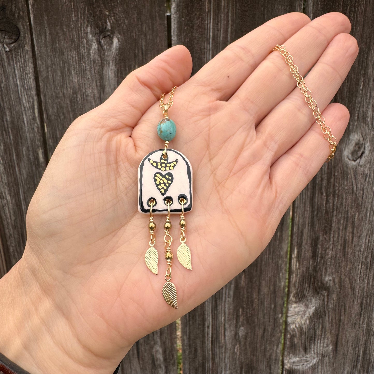 Ceramic black sacred heart and golden leaf fringe Charm Necklace