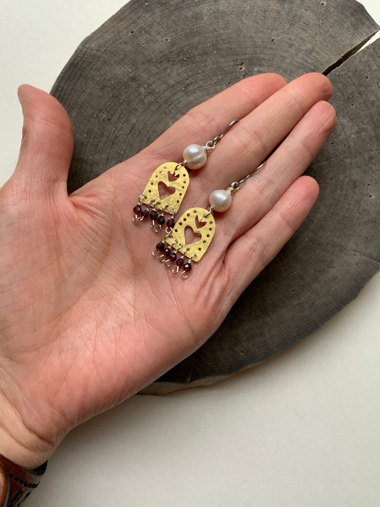 Sacred Heart and garnet dangle earrings, hammered brass Sagrado Corazon earrings