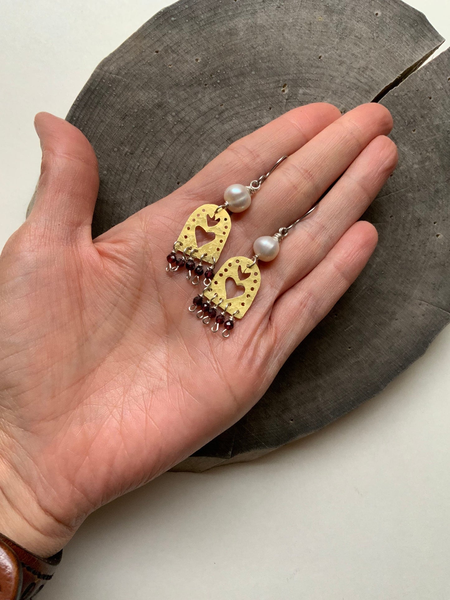 Sacred Heart and garnet dangle earrings, hammered brass Sagrado Corazon earrings